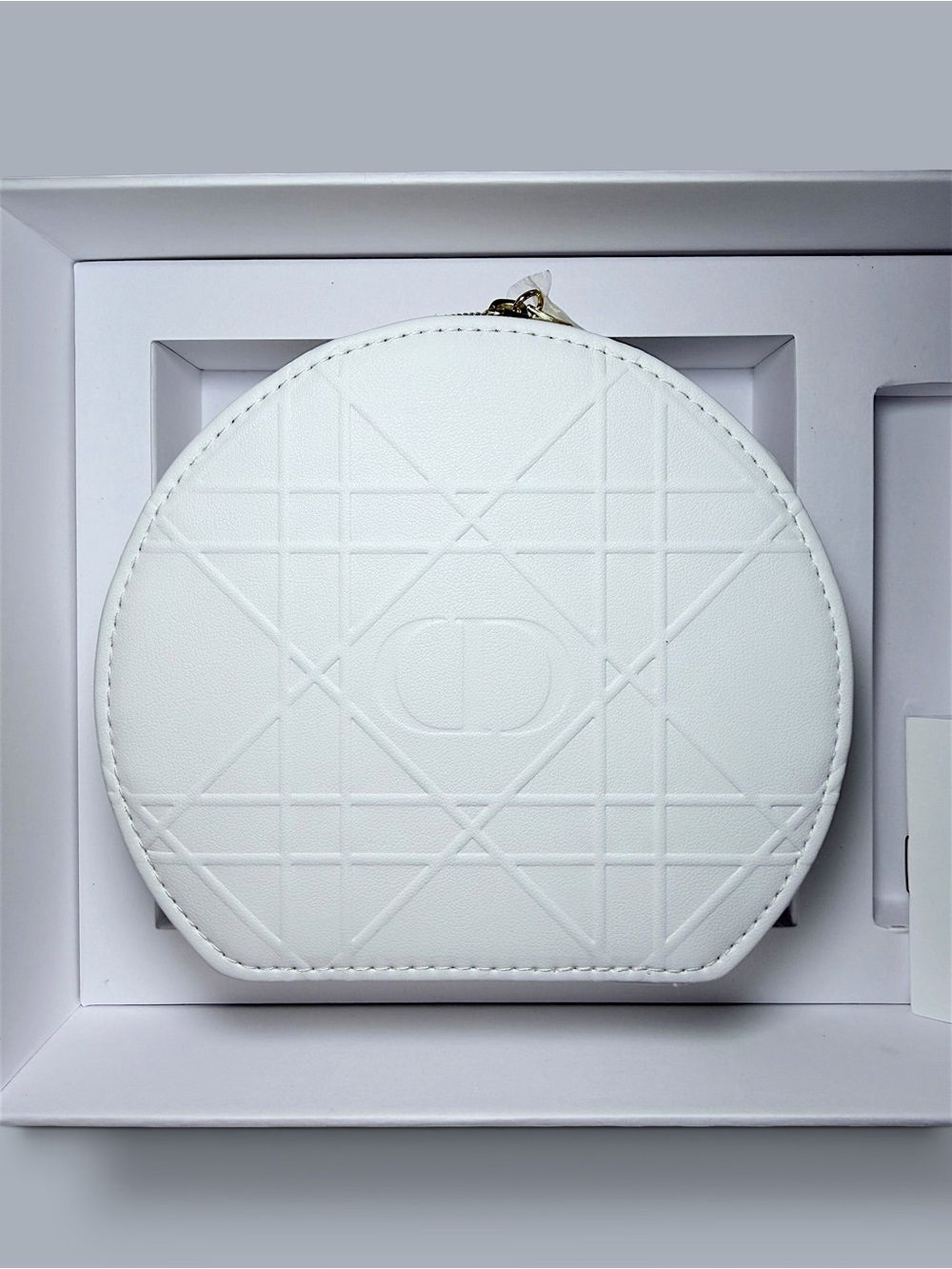 Dior Beauty White Cosmetic Pouch in Cannage pattern.